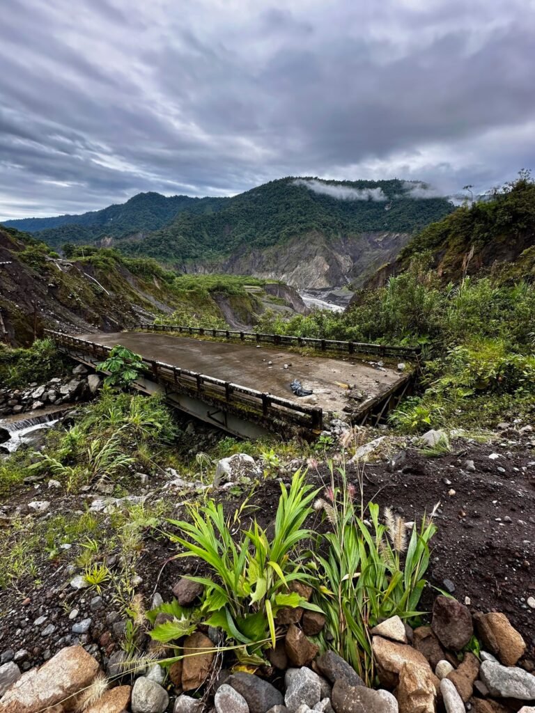 Mudslides, crumbling roads and unmoored bridges greet us as we descend into the jungle.