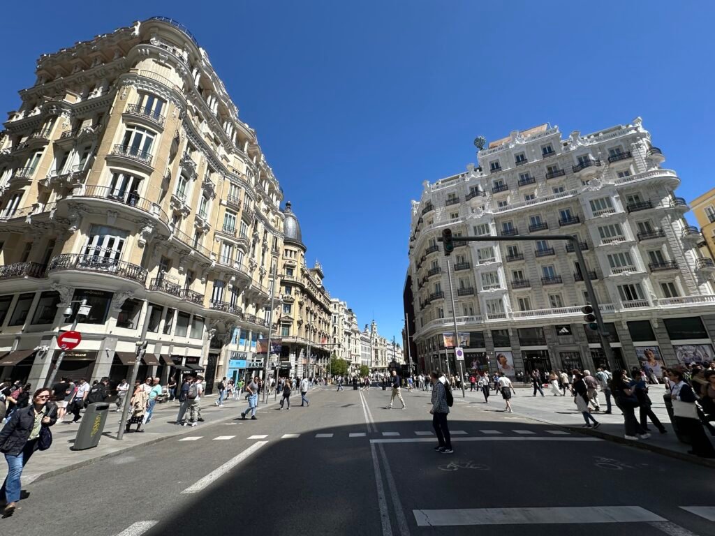 Everybody out! Employees (those not stuck in elevators) filed into the midday Madrid sun.
