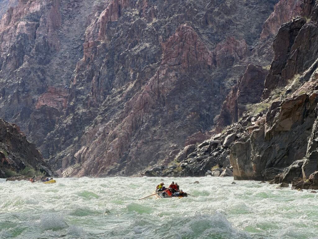 Cam pilots us into + thru one of the 60+ rapids we ran - check out the in-boat video below 